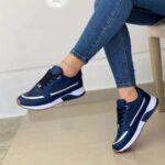 Women’s lace-up flat walking sneakers with synthetic leather, round toe, sequin detail and rubber sole